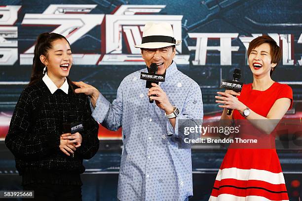 Nana Ouyang, Jackie Chan and Erica Xia-hou share a joke on stage during a press conference and photocall for Bleeding Steel at Sydney Opera House on...