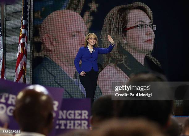 Arizona representative Gabby Giffords arrives onstage on the third day of the Democratic National Convention at the Wells Fargo Center on July 27,...