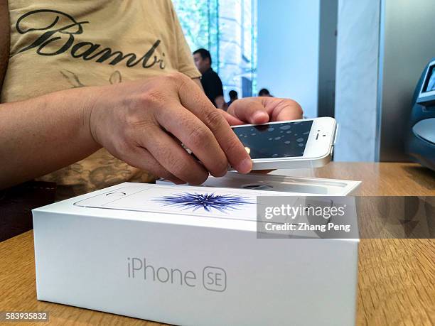 Chinese customer buys an iPhone SE in an Apple shop. As Chinese smartphone makers offer better products, sales in China fell 33% to $8.8 billion in...