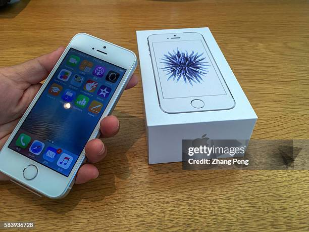 Chinese customer buys an iPhone SE in an Apple shop. As Chinese smartphone makers offer better products, sales in China fell 33% to $8.8 billion in...