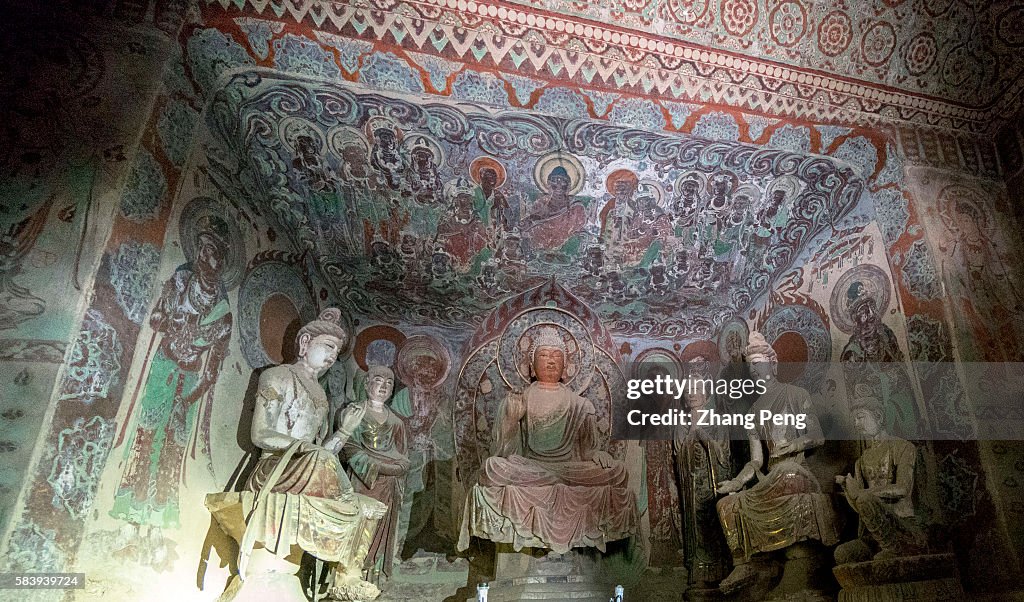 Buddhist statues in Mogao caves. The Mogao Caves, also...