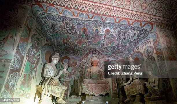 Buddhist statues in Mogao caves. The Mogao Caves, also known as the Thousand Buddha Grottoes, are the best known of the Chinese Buddhist grottoes...