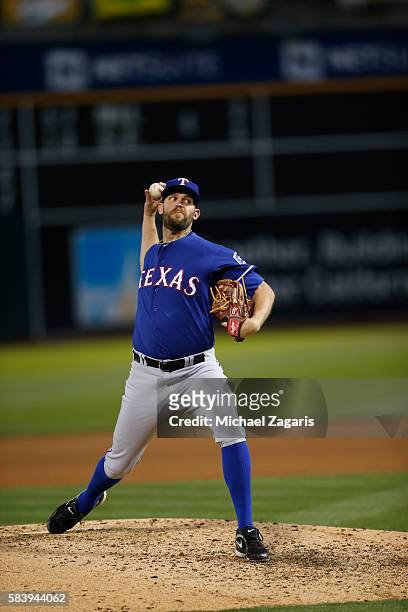 Tom Wilhelmsen of the Texas Rangers pitches during the game against the Oakland Athletics at the Oakland Coliseum on June 13, 2016 in Oakland,...