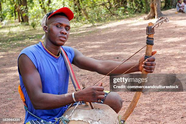 young man with kora - kora music stock pictures, royalty-free photos & images