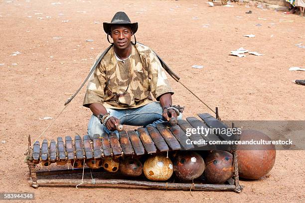 man sitting with a balafon - balafon stock pictures, royalty-free photos & images