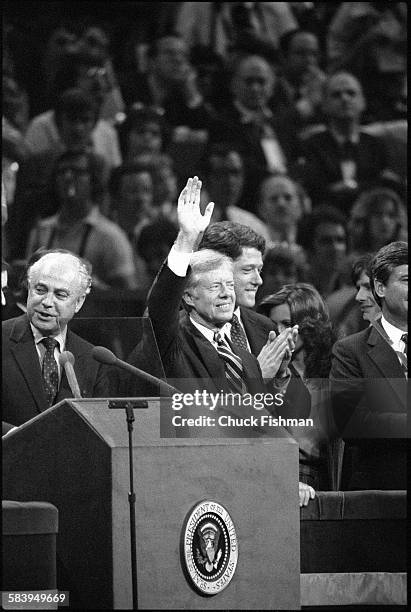 President Jimmy Carter waves to the crowd after addressing the Democratic National Convention as their nominee to run for president for a second...