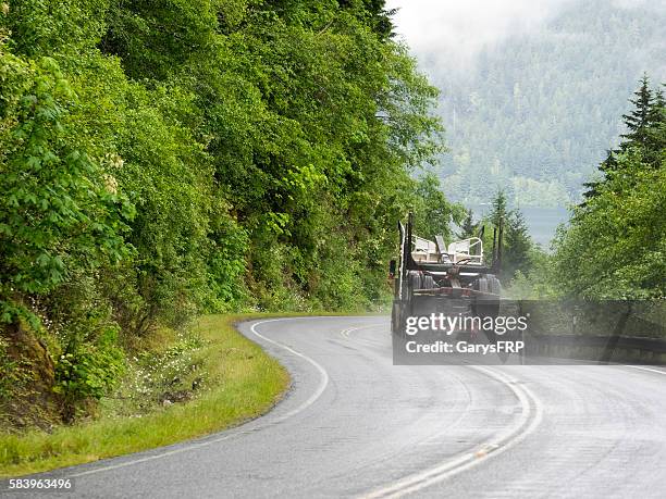 empty log truck rural road port angeles washington state - port angeles washington state stock pictures, royalty-free photos & images