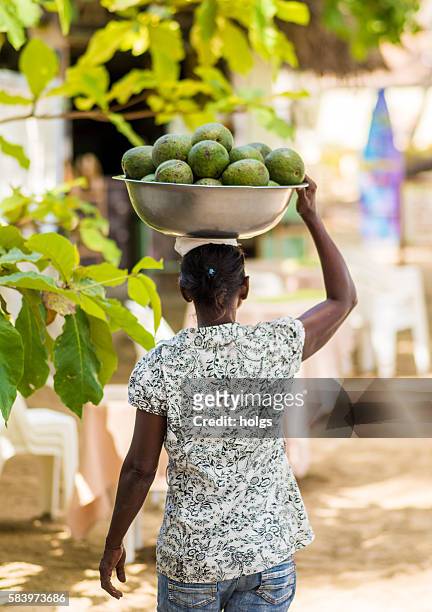 woman carrying fruits - cabarete dominican republic stock pictures, royalty-free photos & images