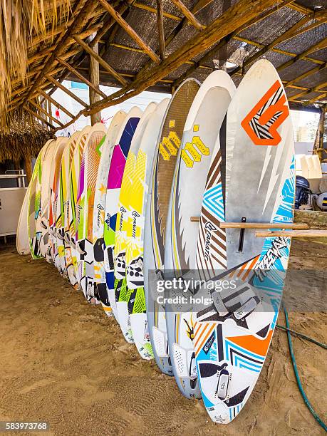 surf boards in sosua - cabarete dominican republic stock pictures, royalty-free photos & images