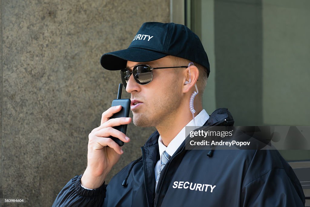 Security Guard Using Walkietalkie Radio High-Res Stock Photo - Getty Images