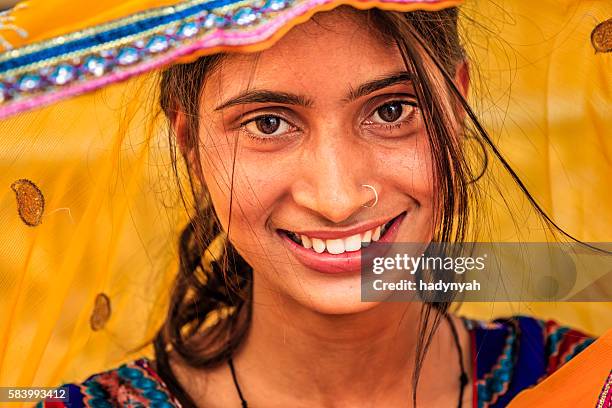 young indian woman in village near jaipur, india - hinduism stockfoto's en -beelden