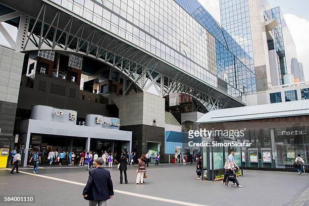 people outside kyoto station in city - kyoto station stock pictures, royalty-free photos & images