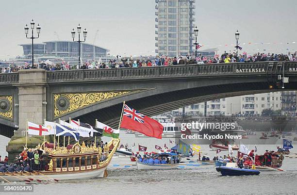 Britain - Boats travel down the River Thames in London on June 3 in a pageant celebrating 60 years since the coronation of Britain's Queen Elizabeth...