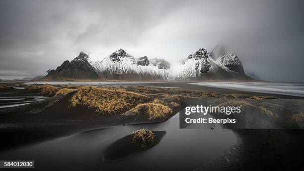 vestrahorn mountain with black sand beach in the east of iceland. - iceland bildbanksfoton och bilder