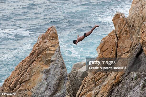 Cliff diver jumps from the top of the famous La Quebrada cliff on July 15, 2016 in Acapulco, Mexico.