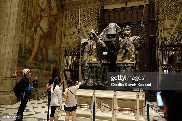 Visitors look at the tomb of Christopher Columbus in Seville Cathedral formerly site of an Islamic Mosque on June 25, 2016 in Seville, Spain. Seville...