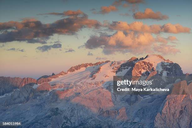 sunset over marmolada peak, dolomites - dolomites italy stock pictures, royalty-free photos & images