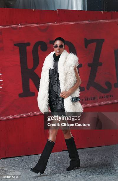 Maya Haile, model and director of Three Goats Organization, an Ethiopian charity wearing Tommy Hilfiger leather coated turtleneck dress with Marc...