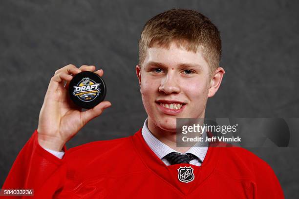 Dennis Cholowski, selected 20th overall by the Detroit Red Wings, poses for a portrait during round one of the 2016 NHL Draft at First Niagara Center...