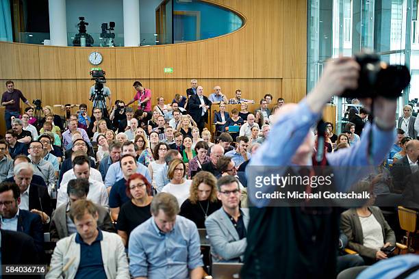 Berlin, Germany Journalists attend German Chancellor Angela Merkel's annual summer press conference in German Federal Press Conference or...