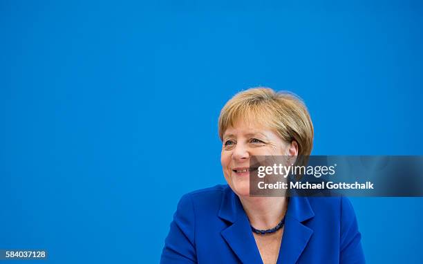 German Chancellor Angela Merkel smiles as she addresses the media during her annual summer press conference in German Federal Press Conference or...