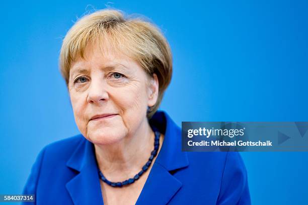 German Chancellor Angela Merkel looks at the camera as she addresses the media during her annual summer press conference in German Federal Press...