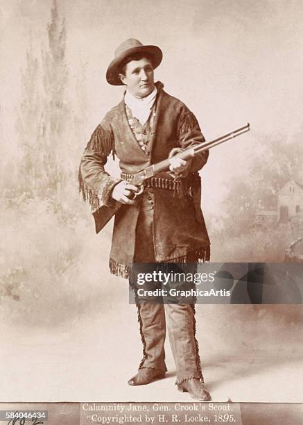 Portrait of Calamity Jane holding a rifle , 1895. Calamity Jane was a frontierswoman and scout for General Crook. Albumen print.