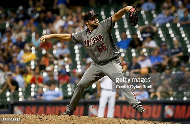 Josh Collmenter of the Arizona Diamondbacks pitches in the eighth inning against the Milwaukee Brewers at Miller Park on July 25, 2016 in Milwaukee,...