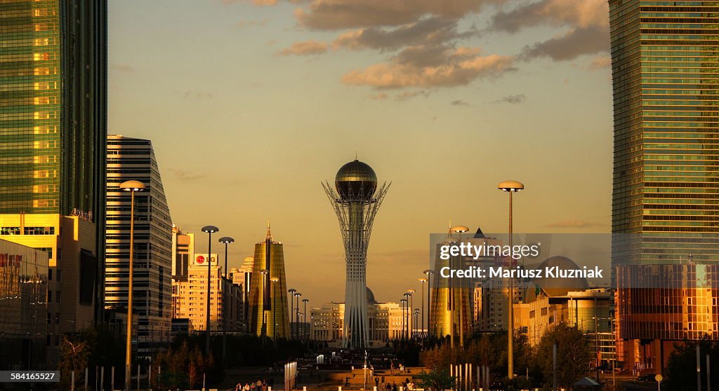 Central modern Astana and Bayterek Tower sunset