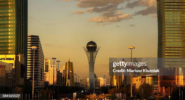 central modern astana and bayterek tower sunset - kazakhstan 個照片及圖片檔