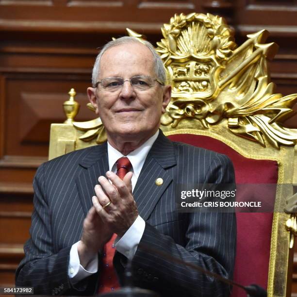 Pedro Pablo Kuczynski applaud before swearing in as Perus President, at the National Congress building in Lima on July 2016. - Kuczynski, who will be...