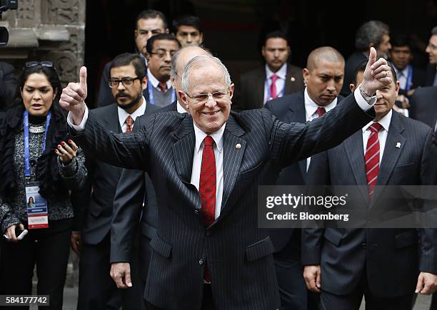 Pedro Pablo Kuczynski, president of Peru, gives the thumbs-up, as he goes to be sworn in, in Lima, Peru, on Thursday, July 28, 2016. The inauguration...
