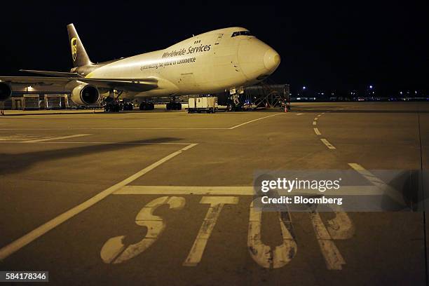 Boeing Co. 747 cargo jet sits parked on the tarmac during the night package sort at the United Parcel Service Inc. Worldport facility in Louisville,...