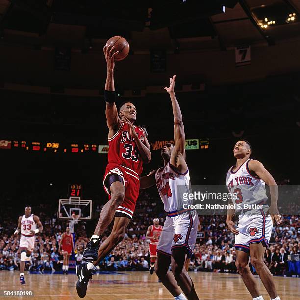 Scottie Pippen of the Chicago Bulls shoots against Charles Smith of the New York Knicks during a game played circa 1993 at Madison Square Garden in...