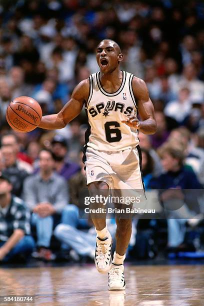 Avery Johnson of the San Antonio Spurs brings the ball up the floor during a game circa 1996 at the Alamodome in San Antonio, Texas. NOTE TO USER:...