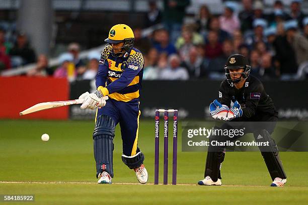 Jacques Rudolph of Glamorgan hits out while Craig Cachopa of Sussex looks on during the NatWest T20 Blast match between Sussex and Glamorgan at The...