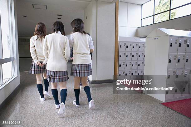 high school students walking corridor, rear view, japan - estudiante de bachillerato chica fotografías e imágenes de stock