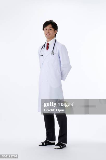 male doctor - hands behind back stock photos et images de collection