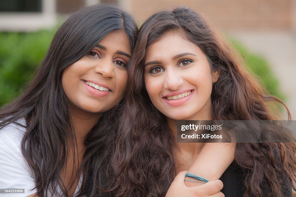 Two young sisters of South Asian ethnicity