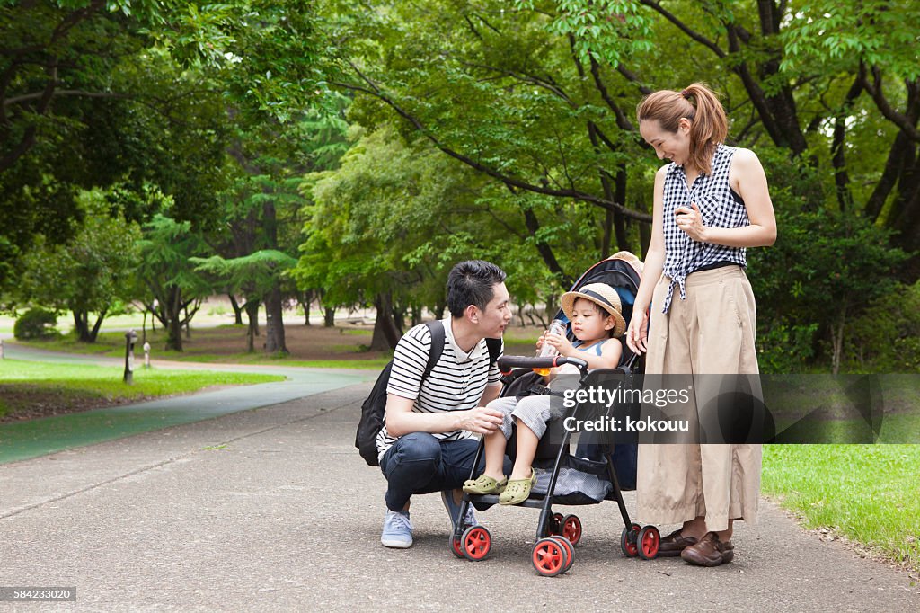 Boy listening to  story of his father while sipping drink