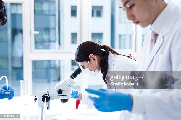 strong look of scientists.laboratory studies. - test tube rack stock pictures, royalty-free photos & images