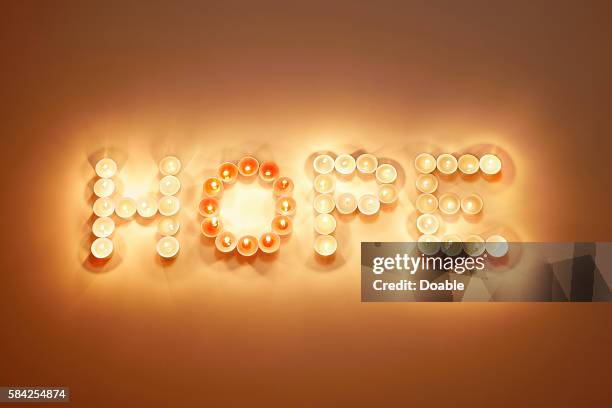 candles spelling out the word hope - hope word stock pictures, royalty-free photos & images