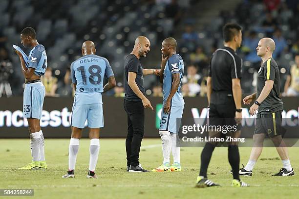 Manchester City's manager Pep Guardiola talk with Fernandinho during the 2016 International Champions Cup match between Manchester City and Borussia...