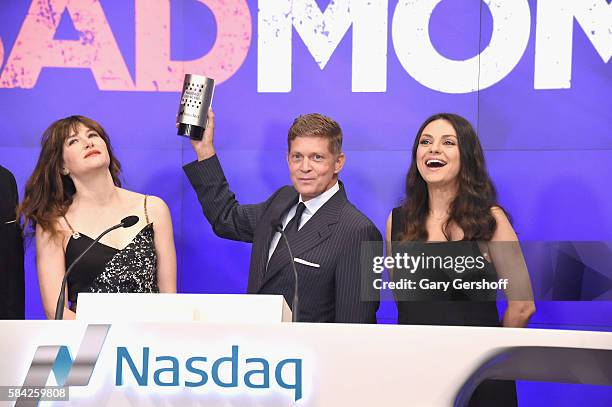 Cast members of the film "Bad Moms," Kathryn Hahn and Mila Kunis with Chairman & CEO, STX Entertainment, Robert Simonds ring the closing bell at...