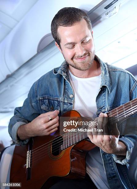 Ryan Hahn of Local Natives performs live, acoustic set at 35,000 feet on Virgin America Flight ahead of Lollapallooza held on Virgin America flight...