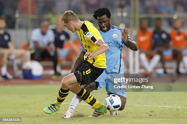 Wilfried Bony of Manchester City contests the ball against Sven Bender of Borussia Dortmund during the 2016 International Champions Cup match between...