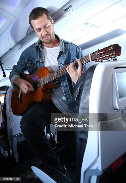 Ryan Hahn of Local Natives performs live, acoustic set at 35,000 feet on Virgin America Flight ahead of Lollapallooza held on Virgin America flight...