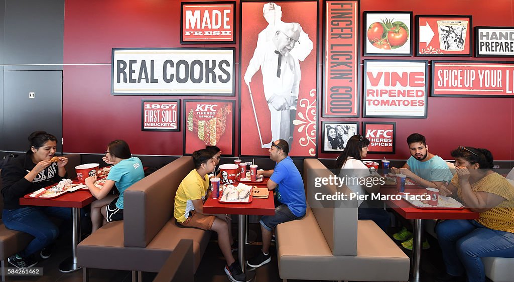 Kfc Opening People eat at KFC restaurant in Milan during the opening of a new ...