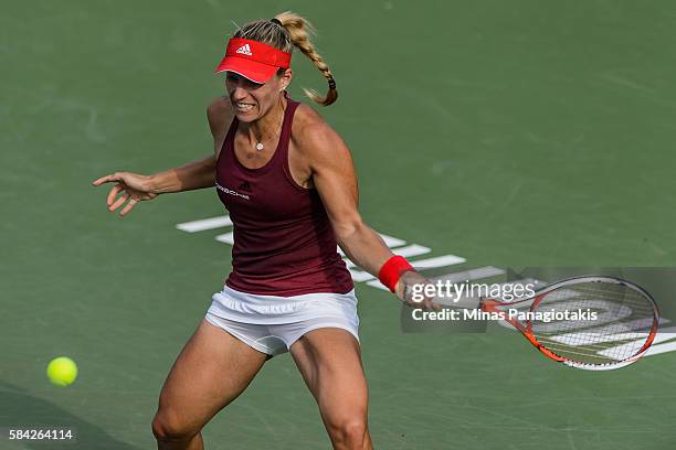 Angelique Kerber of Germany hits a return against Elina Svitolina of Ukraine during day four of the Rogers Cup at Uniprix Stadium on July 28, 2016 in...