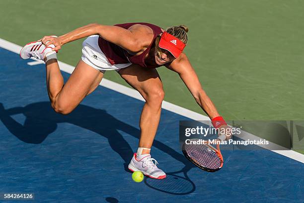 Angelique Kerber of Germany hits a return against Elina Svitolina of Ukraine during day four of the Rogers Cup at Uniprix Stadium on July 28, 2016 in...